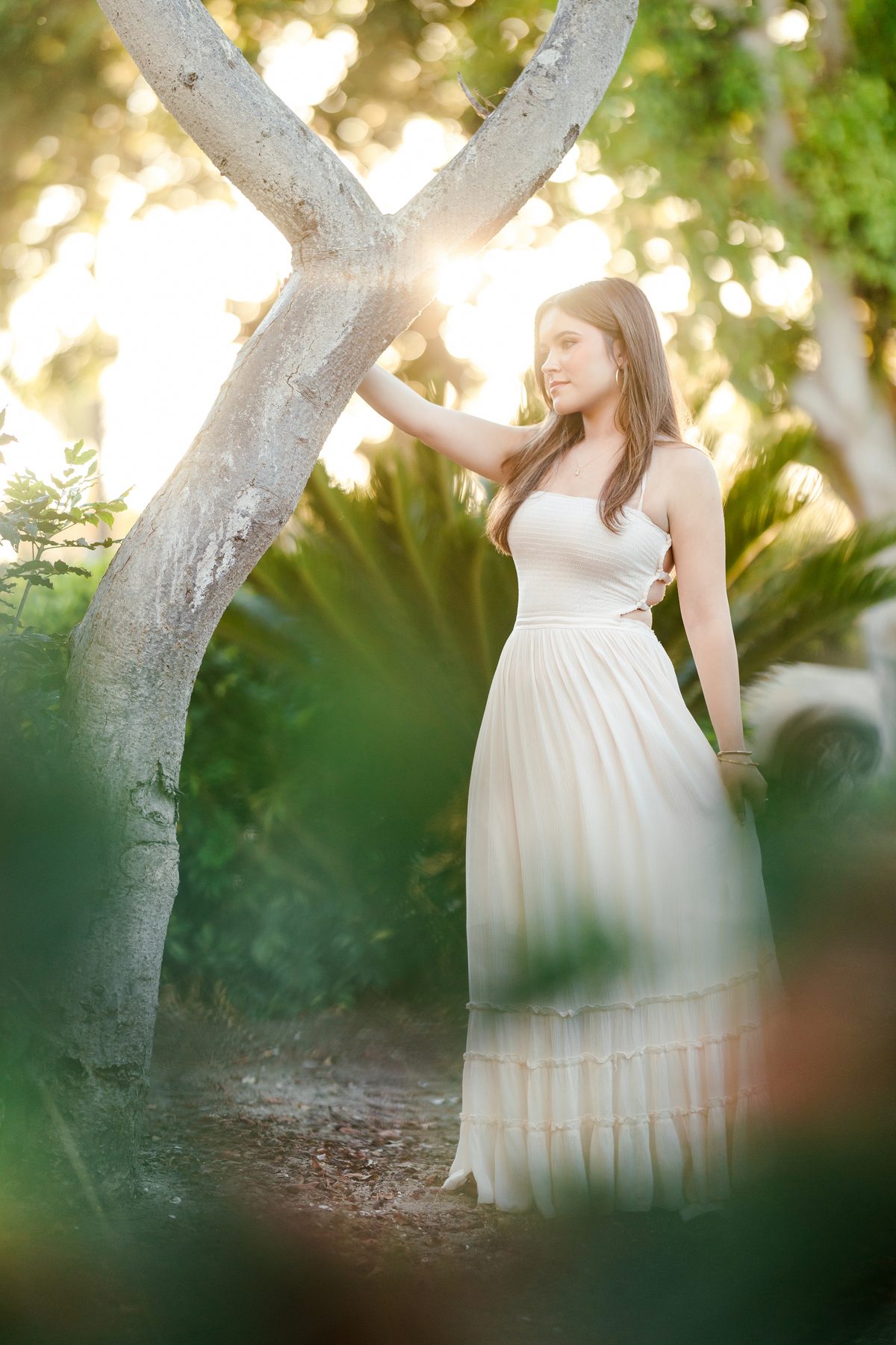 Portrait session at Paradise Point Resort among tropical gardens and golden evening light