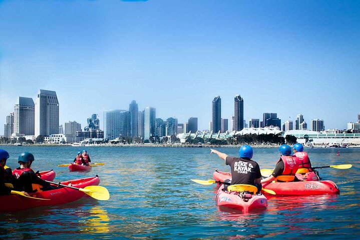 Guided kayak tour on San Diego Bay near Coronado with the city skyline in the background