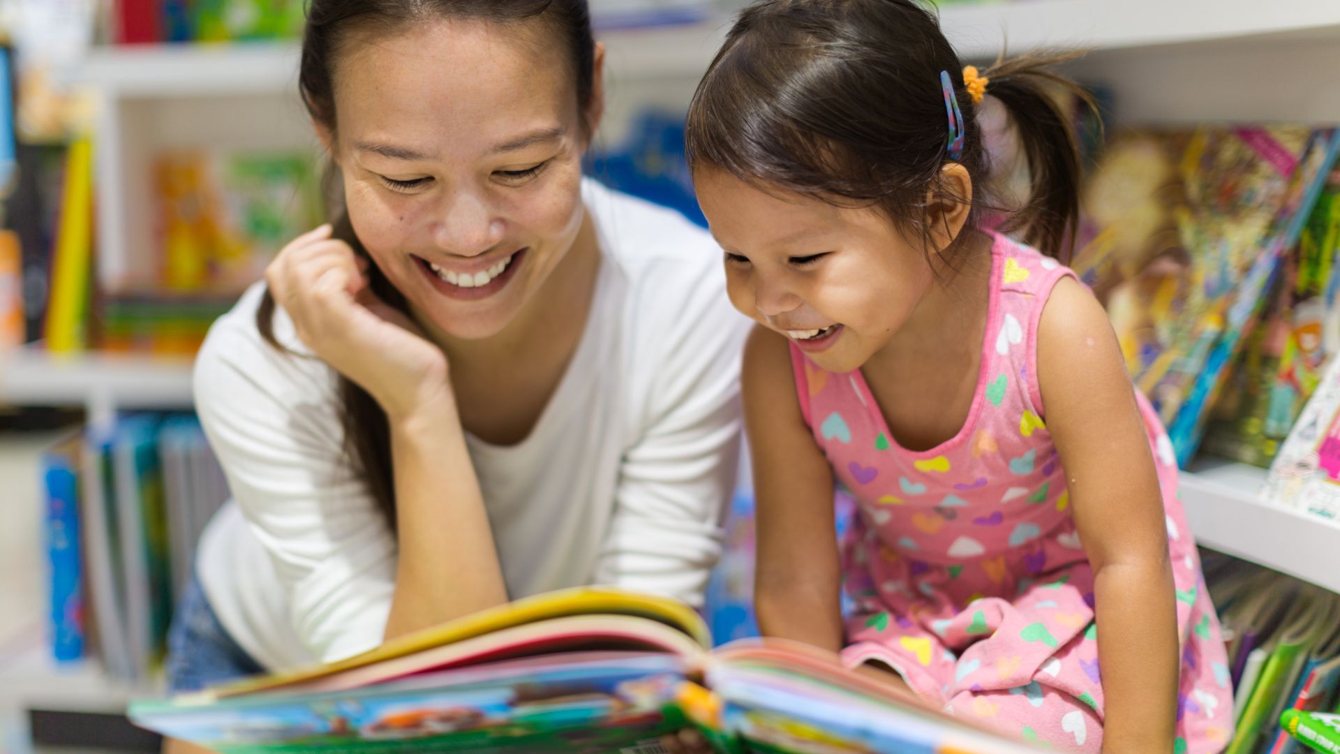 Parent reading a book with a child as part of a calming evening routine