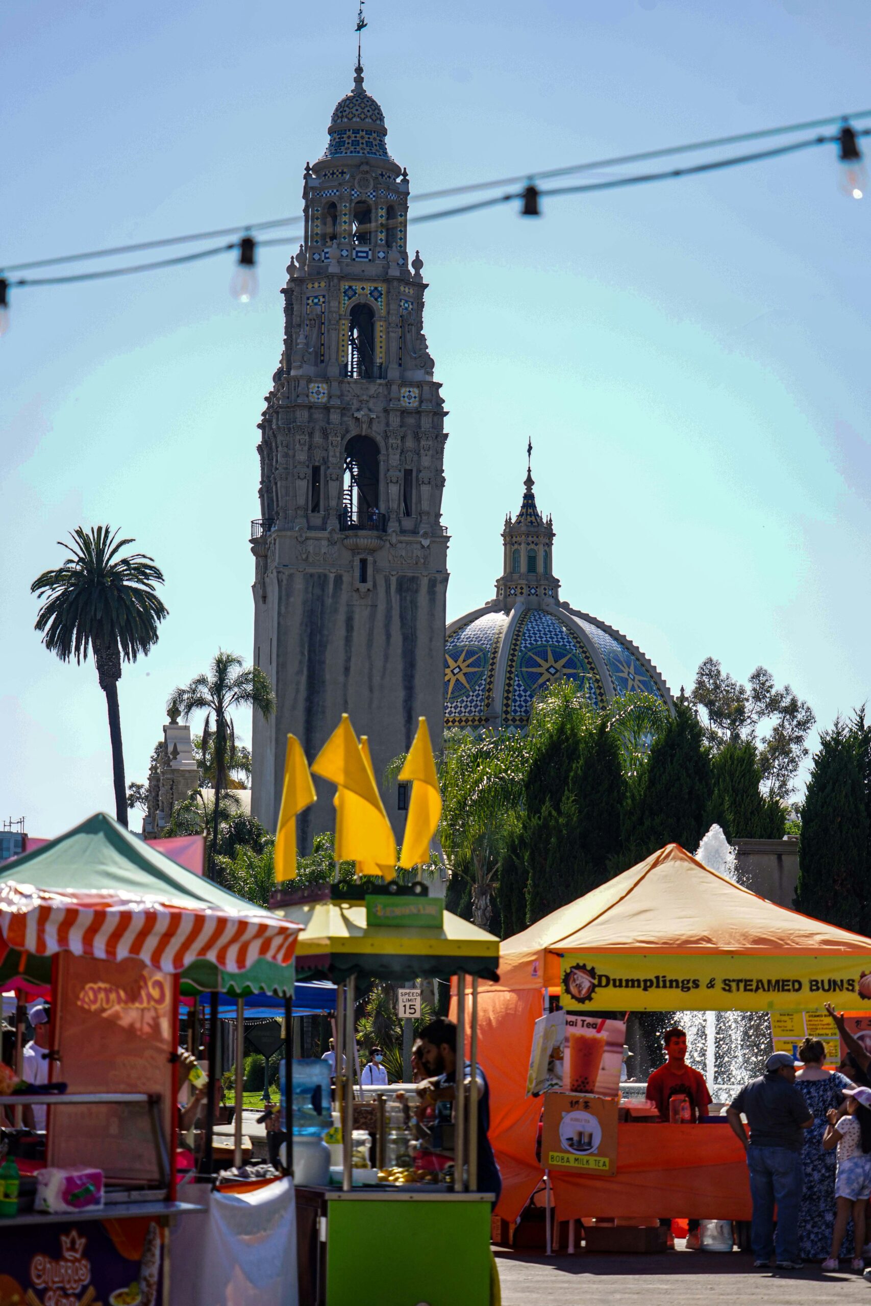 Colorful market stalls and the California Tower at Balboa Park in San Diego