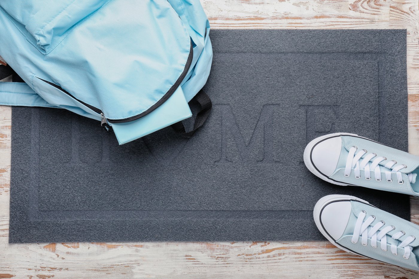 Backpack and shoes lined up by the front door, ready for the school morning