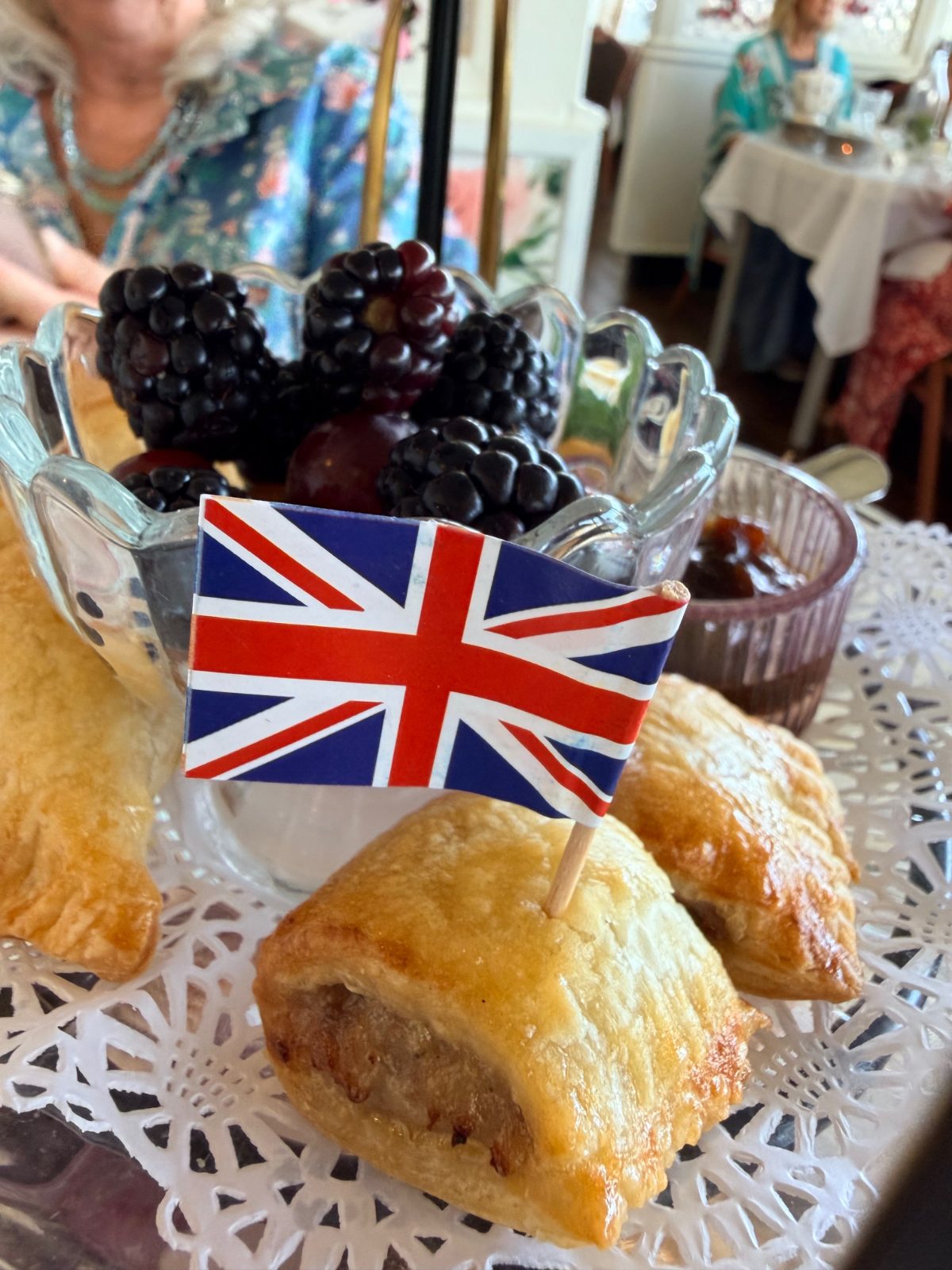 Flaky pastries with a British flag pick at San Diego high tea