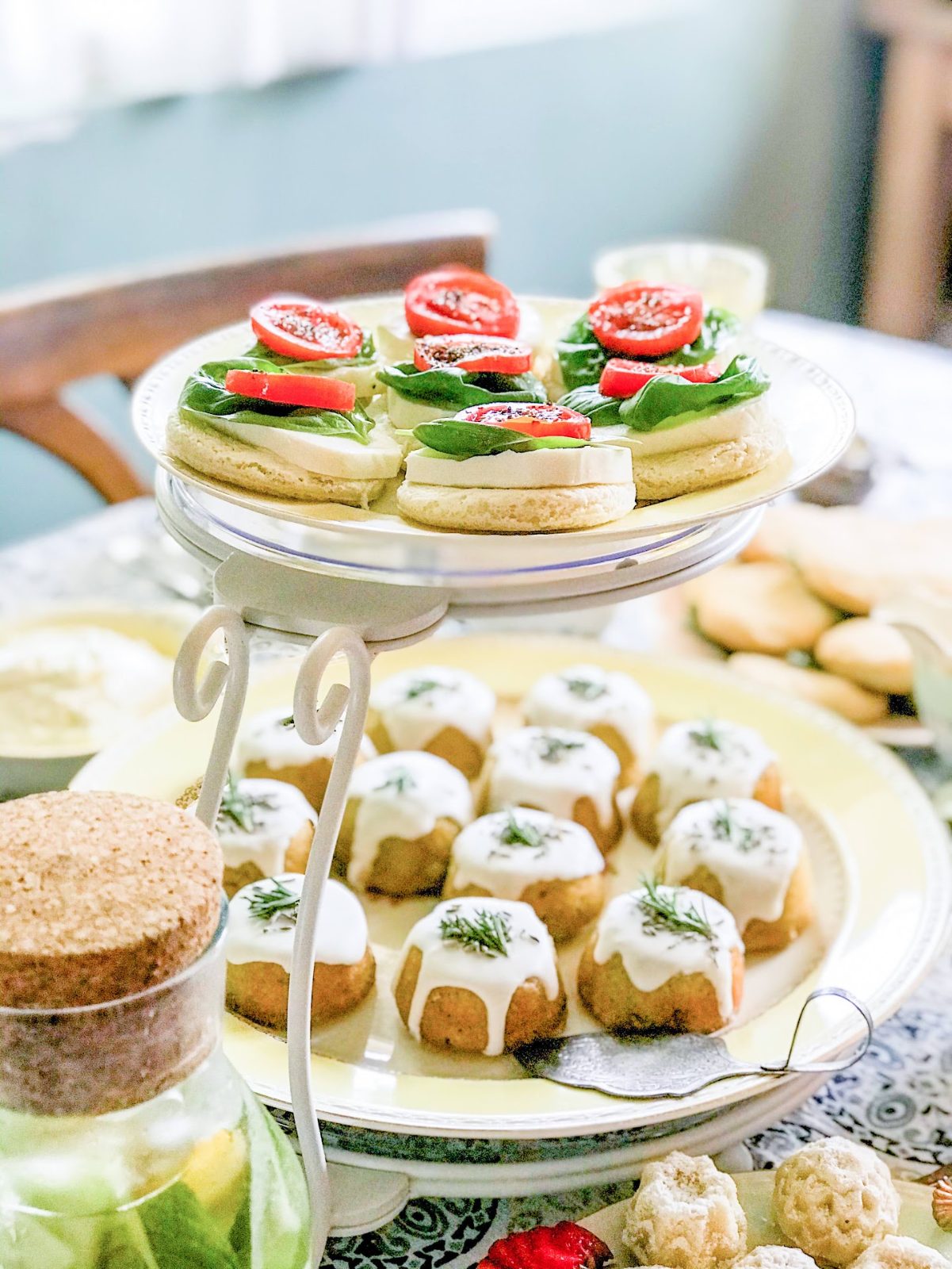 Tiered tray of mini cakes and tea sandwiches for a San Diego high tea